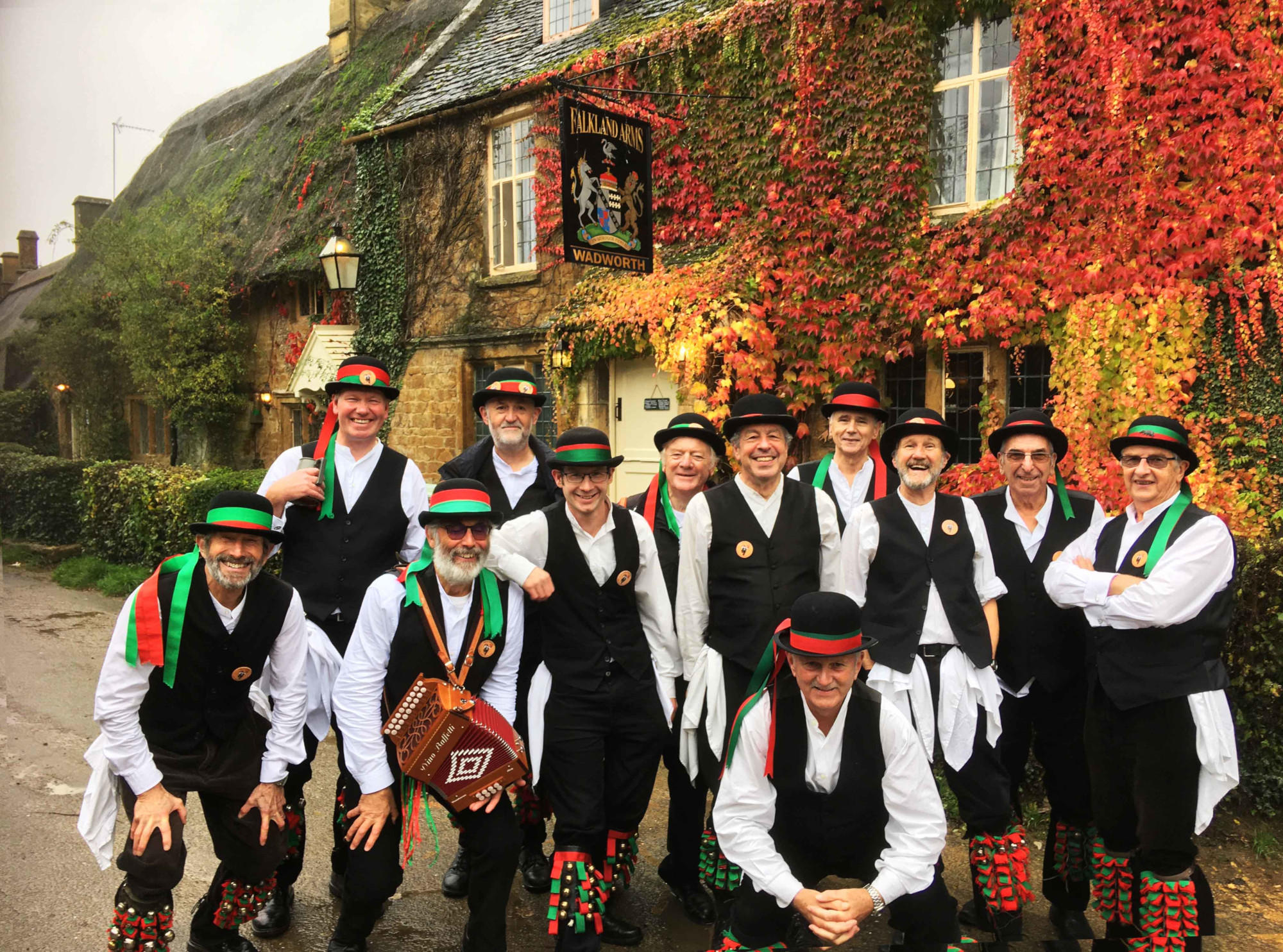 the entire holt morris outside The Falkland Arms at Great Tew